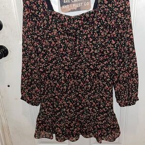Lulu’s Ayesha Black Floral Print Smocked
Off-the-Shoulder Dress